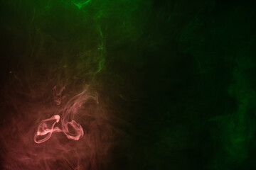 Green and pink steam on a black background.