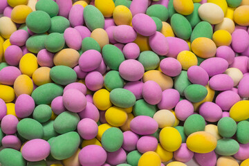 Group of colorful peanuts in glaze.