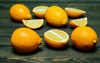 Ripe source lemons  on a wooden background  photographed from above