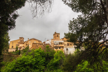Naklejka premium Landscape overlooking the town of Penáguila, on a cloudy day.