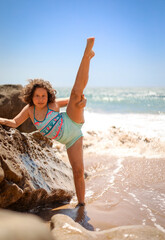 Girl makes twine on the coast.