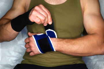 blue sports wrist bandage for fixing the hand