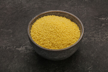 Raw cous cous heap in the bowl