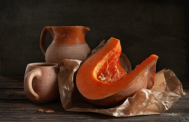 Still life with pumpkin and clay jug in vintage style