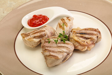 Grilled pork tenderlion with tomato sauce