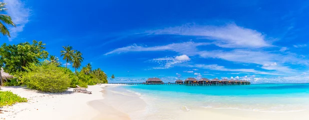 Cercles muraux Bora Bora, Polynésie française Amazing panorama at Maldives. Luxury resort villas seascape with palm trees, white sand and blue sky. Beautiful summer landscape. Amazing beach background for vacation holiday. Paradise island concept