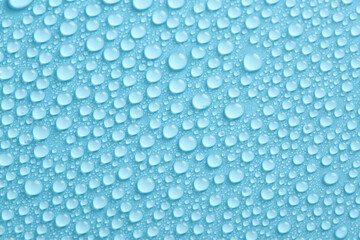 Water drops texture on blue background. Abstract background with pure droplets pattern.