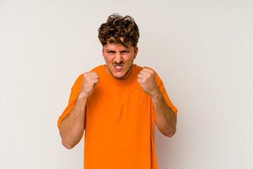 Young caucasian man isolated on white background showing fist to camera, aggressive facial...
