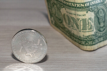 bitcoin coin on a dollar background