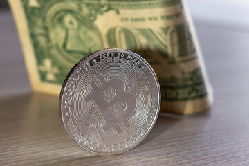 bitcoin coin on a dollar background