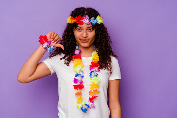 Young Hawaiian woman isolated on purple background showing a dislike gesture, thumbs down. Disagreement concept.