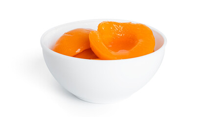 Canned peaches in a white bowl. Sweet peaches in syrup isolated on white background.