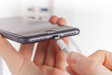 Close-up of the cable connection with the smartphone usb type-c port.
