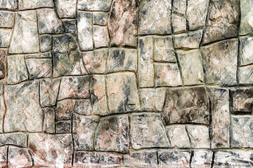 Texture of a brick wall with cracks and scratches which can be used as a background