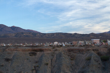 Ancient cemetery on the mountaintop under a beautiful sunset sky in the Andes mountains, Cachi, Salta, Argentina.