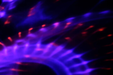 Blur colorful neon light leaks on black background. Defocused illuminated abstract futuristic texture for using over photos as overlay or screen filter