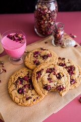 platter of tahini rose chocolate chip cookies with a bite taken out of one cookie