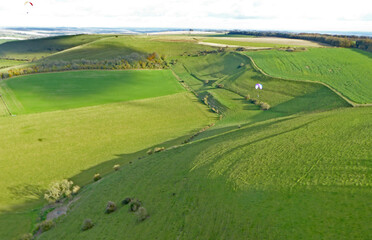 Paragliding above the fields at Monks Down in Wiltshire