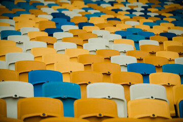 Fototapeta premium Many rows of chairs in stadiums, white, yellow and blue