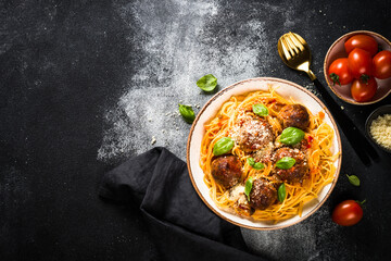 Pasta with Meatballs in tomato sauce at black.