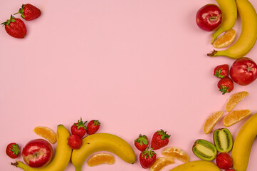fruits and berries on a light background with a place to insert