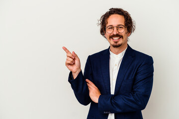Young business man isolated on white background smiling cheerfully pointing with forefinger away.