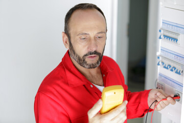 electrician works with electronic equipment
