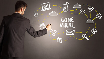 businessman drawing social media icons