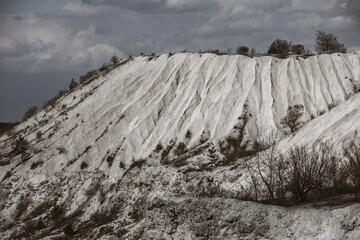 Abandoned limestone quarry. Interesting form of relief. Amazing hills and ground. Dry areas of the earth. Global warming