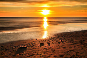 Sunrise on the beach in Arenales del Sol, Alicante - obrazy, fototapety, plakaty
