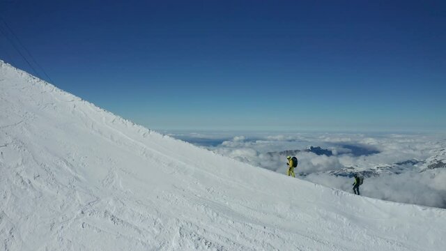 Mountaineers on a ridge filmed with a drone