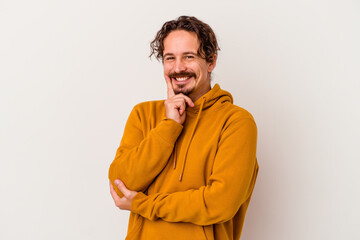 Obraz premium Young caucasian man isolated on white background smiling happy and confident, touching chin with hand.