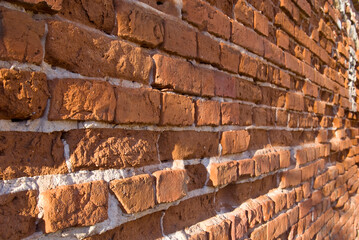 Old weathered brick wall fragment .