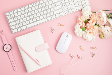 Home office desktop and flowers. Modern workspace with notebook, office stationary