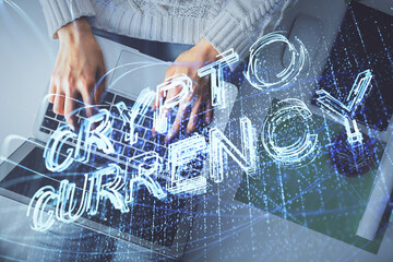 Double exposure of woman hands working on computer and blockchain theme hologram drawing. Top View....