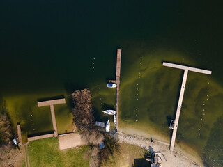 marina for boats, wooden footbridge, Masurian lakes. Aerial view, photos from the drone