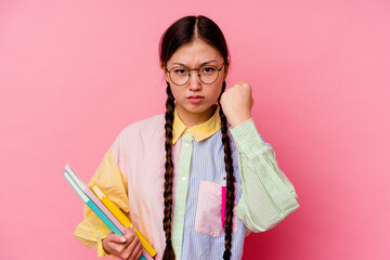 Young chinese student woman holding books wearing a fashion multicolour shirt and braid, isolated...