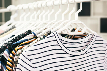 Clothing on hanger at the modern shop boutique