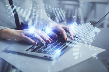 Double exposure of woman hands typing on computer and social network theme hologram drawing. People media concept.