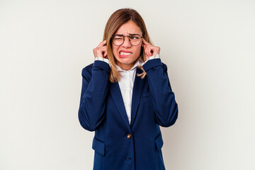 Young business caucasian woman isolated on white background covering ears with hands.