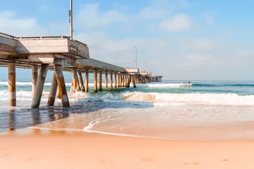 Fotobehang Venice Beach pier with ocean waves in Los Angeles, beautiful postcard view © KseniaJoyg