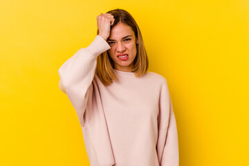 Young caucasian skinny woman isolated on yellow background forgetting something, slapping forehead...