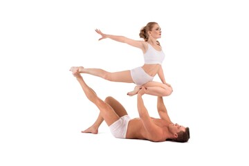 Young athletic couple doing acrobatic support exercise