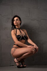 Dreamy young woman in sexy underwear and high heels