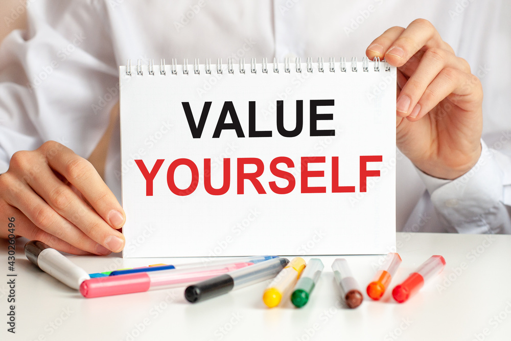 Poster man showing a card with text value yourself, business and positive concept