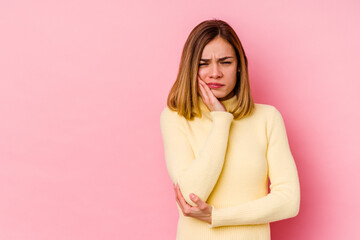 Fototapeta premium Young caucasian woman isolated on pink background who feels sad and pensive, looking at copy space.