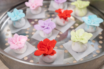 Chinese style colorful flower dumplings before steaming