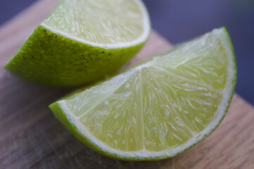Lemon slices on a wooden cutting board