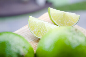 Lemon slices on a wooden cutting board