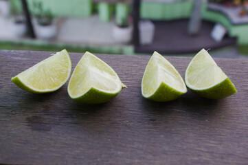 Lemon slices on a wooden cutting board